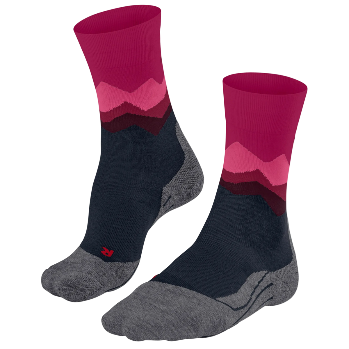 A pair of crew socks with a mountain-patterned design in magenta, pink, and dark red, featuring a navy blue midfoot and a heather gray toe and heel, shown on a plain white background.