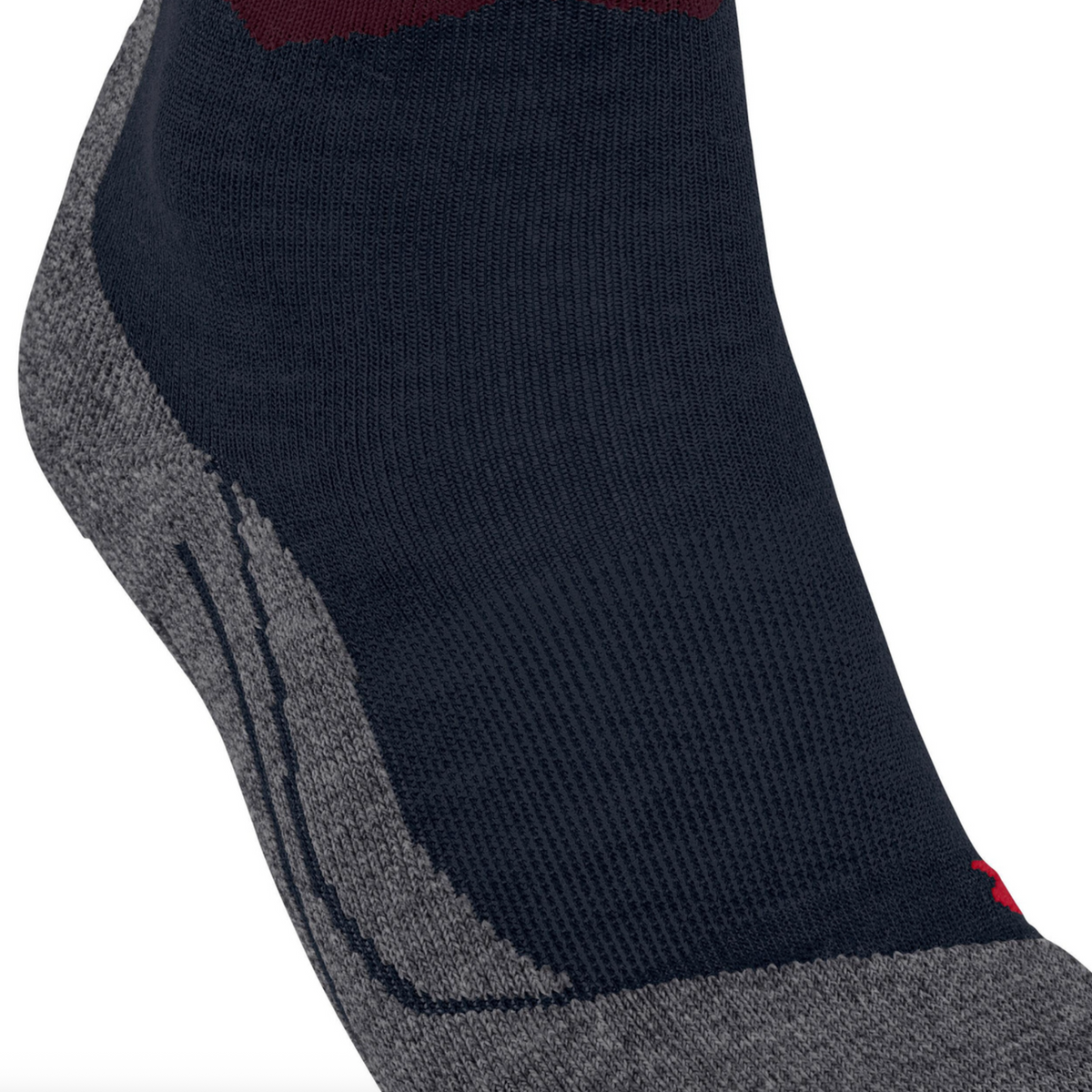 A close-up of a single sock on a white background, featuring a dark navy blue ribbed body, a gray textured toe and heel, and a patterned cuff with pink, burgundy, and dark red wavy stripes.
