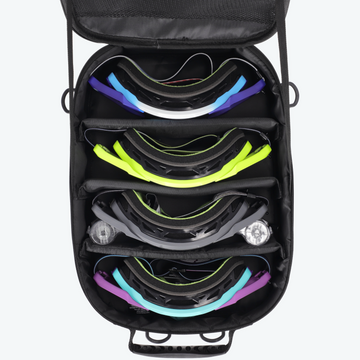 Black case with colorful ski goggles inside on a white background