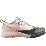 Salomon trail running shoe in light beige and black with red accents, shown from the side against a light gray background.
