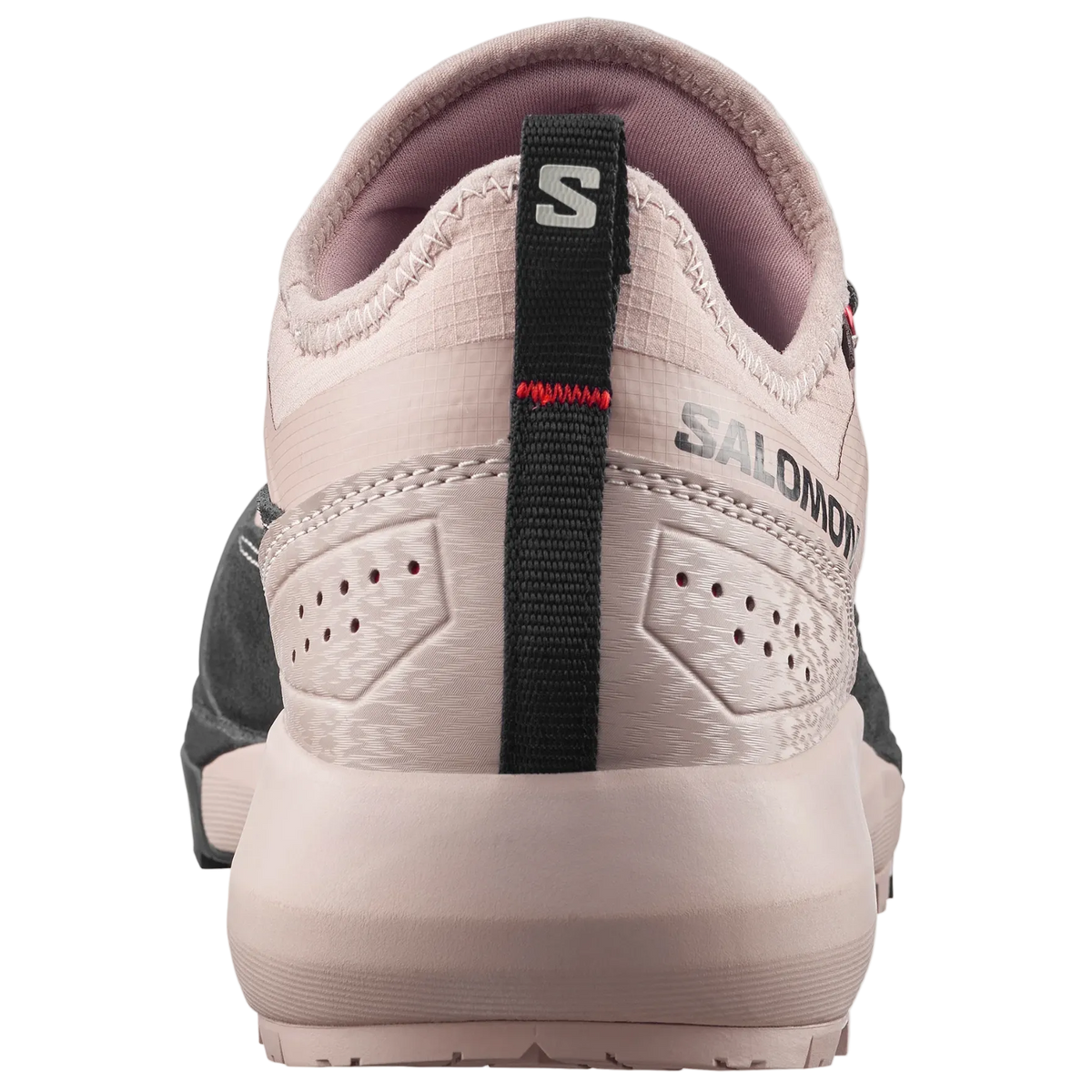 A close-up rear view of a Salomon shoe in light beige and pinkish-beige, featuring a black heel pull tab with the Salomon 'S' logo and 'SALOMON' branding.