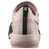 A close-up rear view of a Salomon shoe in light beige and pinkish-beige, featuring a black heel pull tab with the Salomon 'S' logo and 'SALOMON' branding.
