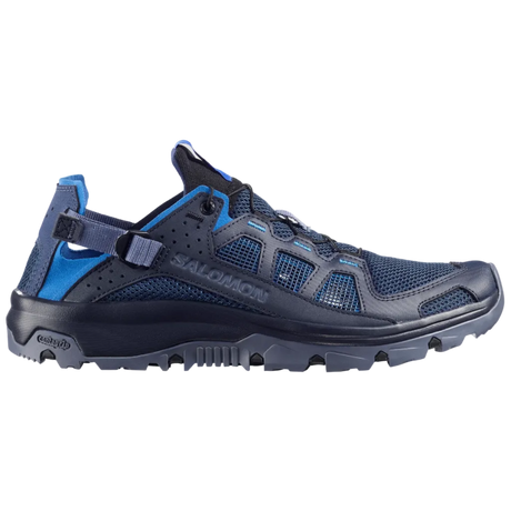 A Salomon trail running shoe in navy blue and bright blue, shown from the side against a light gray background.