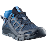 A Salomon hiking shoe in dark gray and blue mesh with a black lace-up system and a blue pull tab, shown from a three-quarters angle on a light gray background.