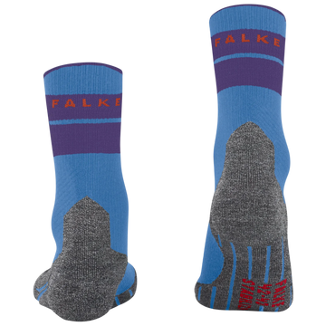 A pair of Falke crew socks shown from the front and back on a plain white background. The socks feature a light blue base with a dark purple band, a gray knit heel and toe area, and red brand lettering.