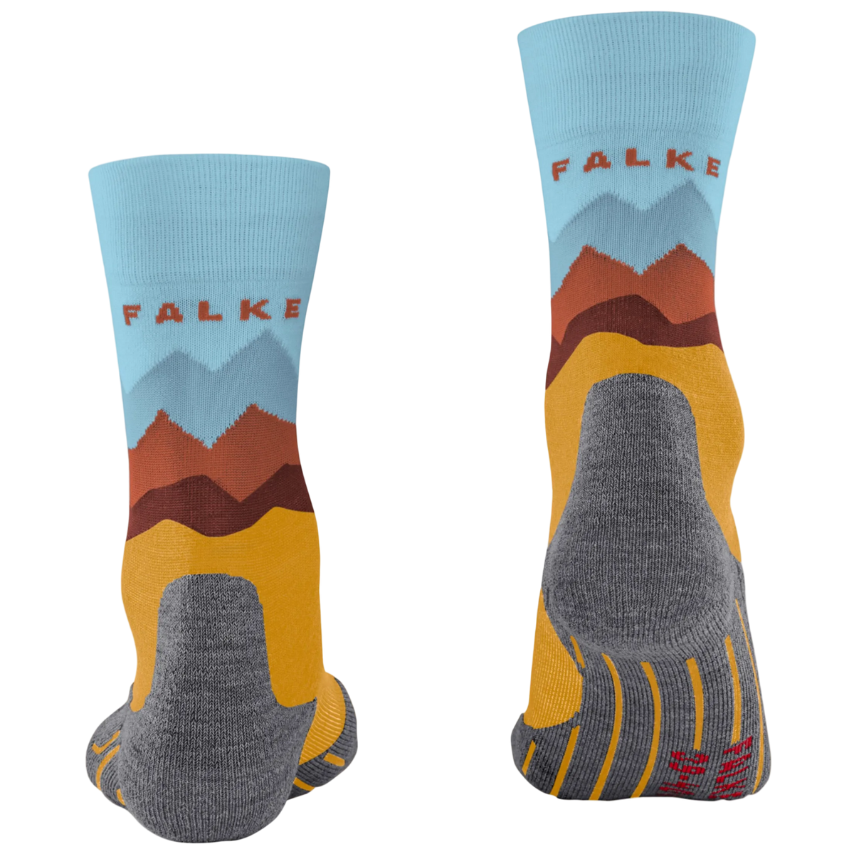 A pair of crew socks shown from the front and back on a plain white background. The socks feature a light blue upper cuff with the brand name 'FALKE' in red, a stylized mountain graphic in blue, brown, and orange, a mustard yellow lower section, and a gray heel, toe, and sole.