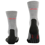 A pair of gray heathered crew socks with black reinforced heels, toes, and soles, featuring the brand name 'FALKE' printed in red on the side and sole.
